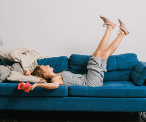 Woman laying on couch