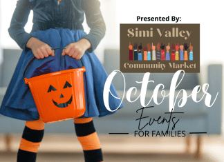Little girl holding a halloween pumpkin for family October events in Ventura County