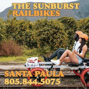 couple riding the sunburst rail bikes