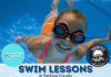Little girl swimming underwater in a pool