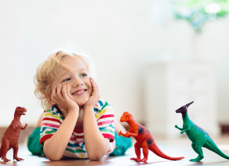 boy playing with dinosaur