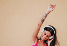 Woman dancing to headphones