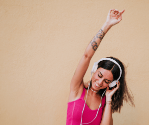 Woman dancing to headphones