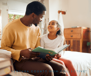 Dad Reading a Book to Daughter