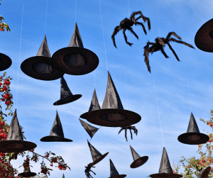 witch hats and spiders hanging in sky