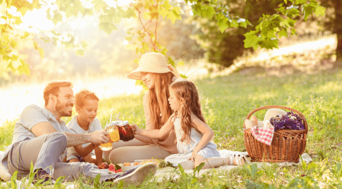 family enjoying an outdoor picnic