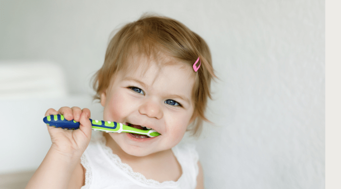 Young girl brushing teeth