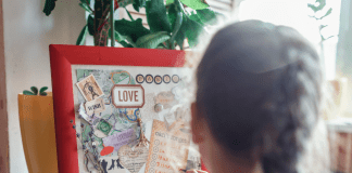 little girl making a vision board for the new year