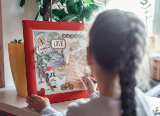 little girl making a vision board for the new year