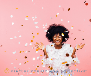 Celebrating happiness, young woman with big smile throwing confetti